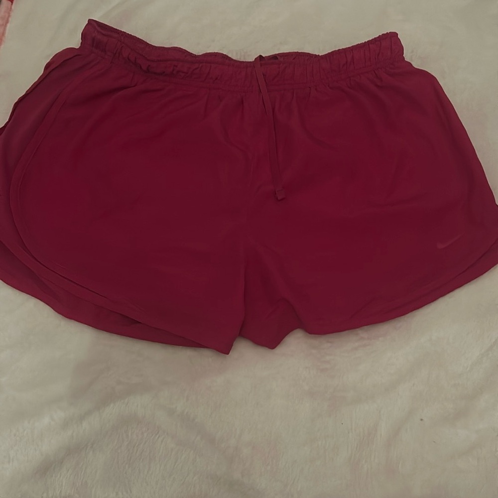 Pink Nike running shorts